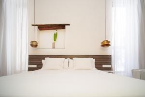 Posteľ alebo postele v izbe v ubytovaní Apartamentos Alcoba 13