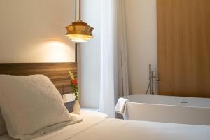 Posteľ alebo postele v izbe v ubytovaní Apartamentos Alcoba 13