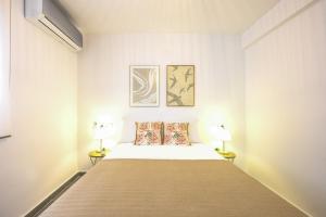 Łóżko lub łóżka w pokoju w obiekcie Belgica 2 - 2 room city & beach by 10ToSea
