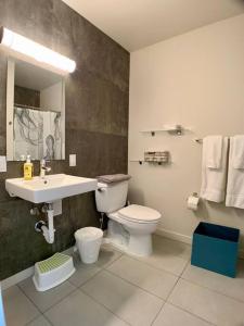 a bathroom with a toilet and a sink at Lofty Studio Prime Cap Hill Area Mins to Downtown in Seattle