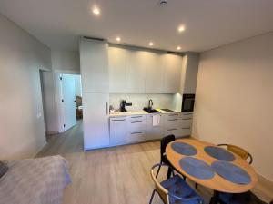 Kuchyň nebo kuchyňský kout v ubytování Monte Urbo apartments