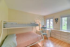a bedroom with a bunk bed and a desk at Charming Canandaigua Lake House w/ Deck & Views! in Rushville