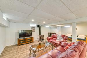 a living room with two couches and a tv at Charming Canandaigua Lake House w/ Deck & Views! in Rushville