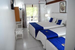 Cama ou camas em um quarto em Hotel Solar do Imperador