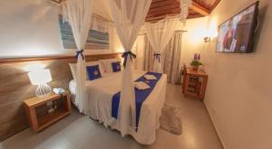 Cama ou camas em um quarto em Hotel Solar do Imperador