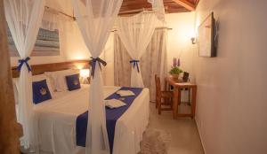 Cama ou camas em um quarto em Hotel Solar do Imperador