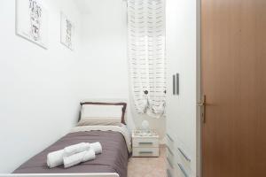 Кровать или кровати в номере Nina Home - Selfcheck-in