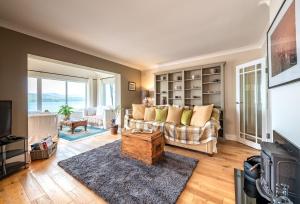 a living room with a couch and a tv at Seahaven in Kenmare