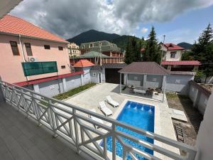 a view of a swimming pool from a balcony at Gabala Modern Harmony in Gabala