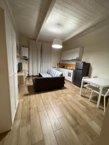 a living room with a couch and a table at Sea apartments2 in Terracina