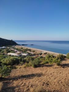 a view of the beach from the top of a hill at La Formica in Ascea