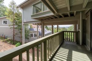 a porch of a home with a wooden deck at Bright Spacious Studio High Ceilings Emerald Hills in Emerald Lake Hills