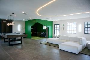 A seating area at Boho Tampa Townhouse - Pool, Gym, Arcade