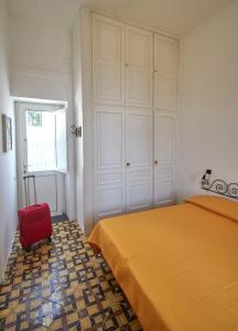 A bed or beds in a room at La Terrazza sul blu di Capri