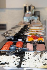 a row of plates of food on a buffet at Leonis Hotel in Kaş