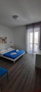 Postel nebo postele na pokoji v ubytování La Llua Alghero