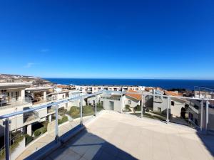 an apartment balcony with a view of the ocean at Sun Village Villa Byala in Byala