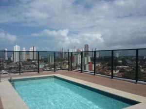 a swimming pool on the roof of a building at Monte Mulanje Home Service in João Pessoa