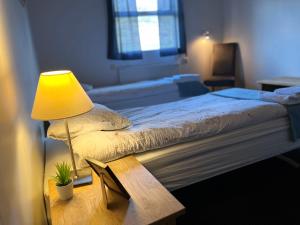 Ένα ή περισσότερα κρεβάτια σε δωμάτιο στο Engimyri Lodge