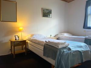 Ένα ή περισσότερα κρεβάτια σε δωμάτιο στο Engimyri Lodge