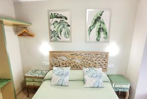 Kama o mga kama sa kuwarto sa HOSTAL RIGAU