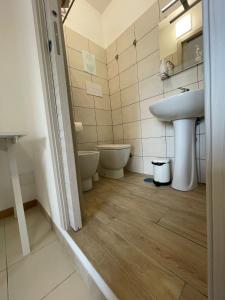 a bathroom with a sink and a toilet at Ce sta 'o mar for in Naples
