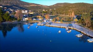 an aerial view of a harbor with boats in the water at Kritharia Guesthouse Volos in Kritharia