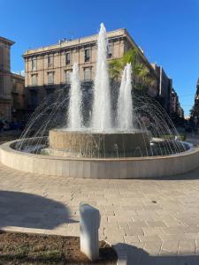 a water fountain in front of a building at Guest House Isabel Pinto in Bisceglie