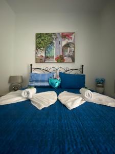 Postel nebo postele na pokoji v ubytování Rethymno Blue Apartments + 37 fotografií