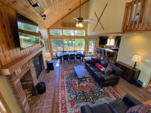 an aerial view of a living room with a fireplace at New Property! Updated 3 bed 3 bath condo with mountain ski slope views in Bretton Woods in Bretton Woods