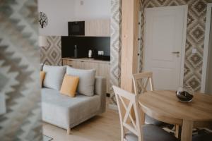 a living room with a couch and a table at Malinova 36 in Wisła