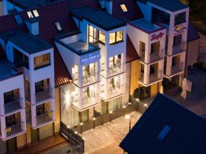 an aerial view of a building at night at Polanka Apartamenty in Niechorze