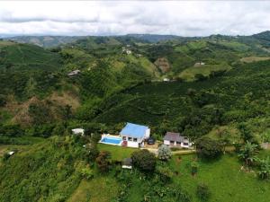 an aerial view of a house on a mountain at La Martina Palestina in Palestina