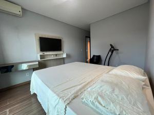 Llit o llits en una habitació de Duplex em Guarapari com piscina privativa!