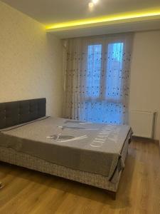a large bed in a room with a window at westsid in Beylikduzu