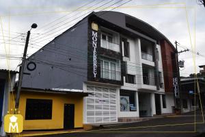 un edificio con un cartel en el costado en HOTEL MONTERREY, en Mocoa