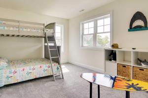 a bedroom with bunk beds and a surfboard at Ocean View Home with Kayaks about 2 Mi to Bethany Beach in Ocean View