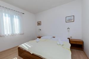 Posteľ alebo postele v izbe v ubytovaní Apartments Ivan M