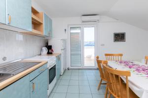 Kuchyňa alebo kuchynka v ubytovaní Apartments Ivan M