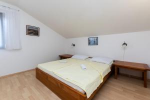 Posteľ alebo postele v izbe v ubytovaní Apartments Ivan M