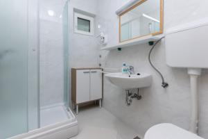 Kúpeľňa v ubytovaní Apartments Ivan M