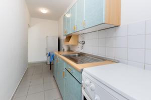 Kuchyňa alebo kuchynka v ubytovaní Apartments Ivan M