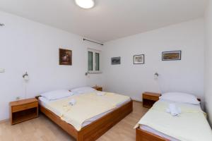 Posteľ alebo postele v izbe v ubytovaní Apartments Ivan M