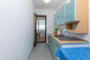 Kuchyňa alebo kuchynka v ubytovaní Apartments Ivan M
