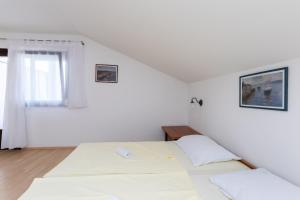 Posteľ alebo postele v izbe v ubytovaní Apartments Ivan M