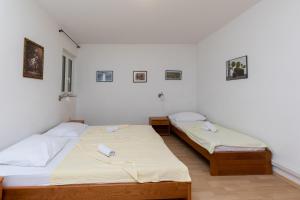 Posteľ alebo postele v izbe v ubytovaní Apartments Ivan M