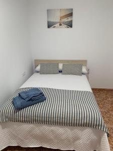 Postel nebo postele na pokoji v ubytování Apartamentos custodio