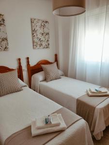 Katil atau katil-katil dalam bilik di Apartamento La Manga del Mar Menor