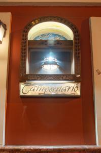 a sign on the wall of a restaurant at Hotel Campanario in Cuenca