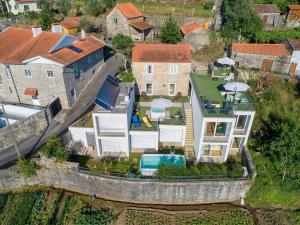 an aerial view of a house with a swimming pool at Villa Redouça in Cedrim